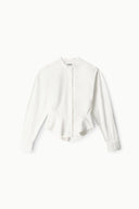 White button-front peplum blouse with stand collar and long sleeves
