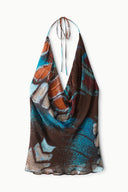 Printed sleeveless halter top with draped cowl front and butterfly-sky pattern