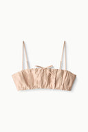Sandrose silk bandeau top with spaghetti straps, gathered ruffle trim, and bow