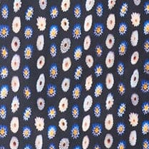 Cecile silk scarf close-up: navy with white and orange circular daisy motifs