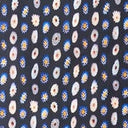 Cecile silk scarf close-up: navy with white and orange circular daisy motifs