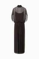 Dark brown long dress with sheer batwing sleeves, high neck, and pleated skirt