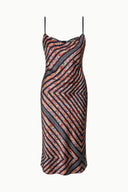 Silk midi dress with spaghetti straps and zigzag chevron pattern, black base.