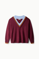 Burgundy knit sweater with V-neck and multicolor striped trim