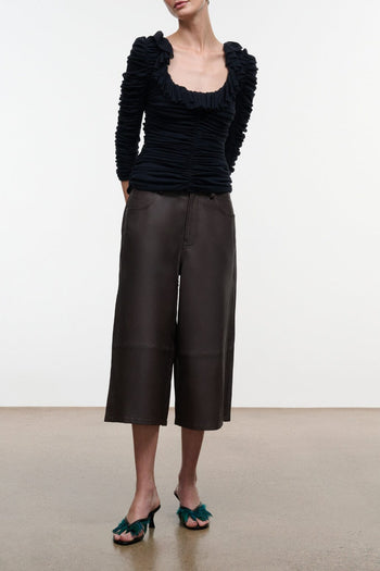 Dark brown leather culotte with wide leg, mid-calf length and front pockets