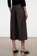 Dark brown leather culottes from back, mid-calf wide leg with patch pockets