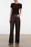 Dark brown leather pants, high-rise waist, button fly, side pockets, wide straight legs