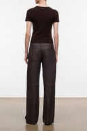 Dark brown leather pants, back view with two patch pockets and straight wide legs