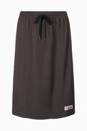 Dark oak knit skirt with elastic waistband and black drawstring, straight midi hem