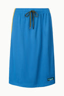 Haskell skirt in blue with elastic waistband and drawstring, textured knit with hem logo