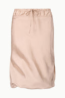 Silk skirt in sandrose pink with elastic drawstring waist and gathered midi hem