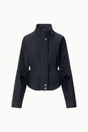 Black cropped jacket with stand collar, snap front, long sleeves
