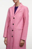 WYATT leather coat close-up, wild rose pink notched lapel and buttoned chest pocket