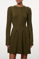 Olive cable-knit sweater dress close-up, textured cable pattern, long sleeves