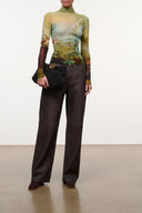 Fitted long-sleeve mock-neck top with watercolor landscape print and sheer sleeves