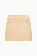 Light camel mini skirt with front flap pockets and button
