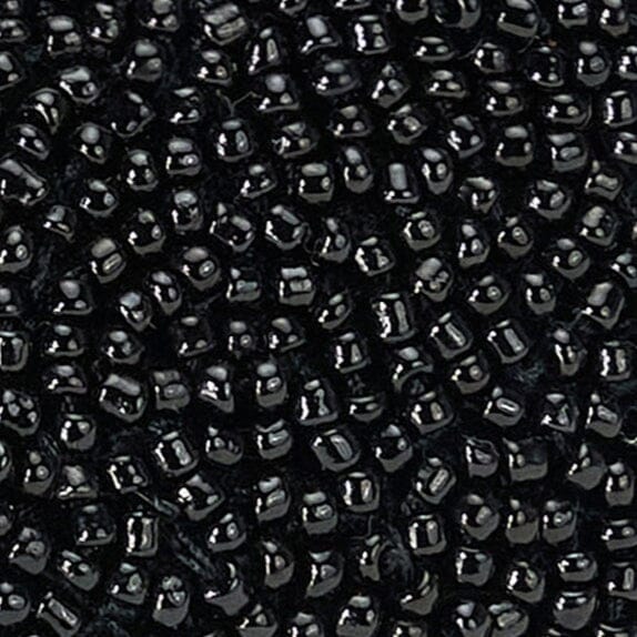 Close-up of black beaded texture on mule upper