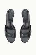 Pair of black wedge slide sandals with cushioned footbed and platform sole