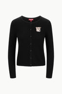 Black cashmere cardigan flat lay, button front, dog graphic patch