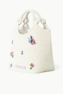 Off-white beaded tote bag with multicolor butterflies and flowers, side view
