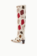 Tall suede patchwork boot with cream and multicolor heart motifs and low heel