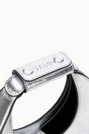 Silver top strap with rounded snap and stitched leather edge