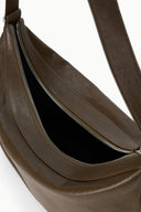 Dark brown leather shoulder bag interior, zip pocket and black lining detail