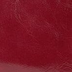 Wine-red leather satchel texture close-up with subtle grain