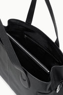 Black tote bag interior view with zippered pockets and side tabs