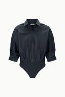 Black button-front bodysuit with pointed collar and cuffed long sleeves