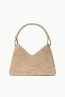 Beige suede shoulder bag with rounded top handles and 'STAUD' logo on front