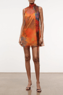 Sleeveless sheer mini dress with high neckline, orange floral print overlay