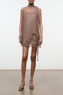 Taupe sleeveless mini dress with high neck and feather trim at hem, tie tassels