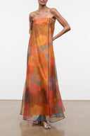 Strapless maxi dress with orange floral print and flowing sheer skirt