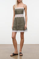 Linen mini dress in thyme green with lace-trimmed bodice and hem, spaghetti straps