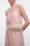 Sleeveless satin top with sheer yoke and feather hem trim, blush pink