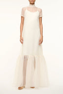 White maxi dress with short sheer sleeves and tiered ruffle hem