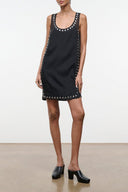 Black sleeveless studded shift dress with round neckline and button-like trim