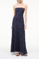 Navy strapless maxi dress with fitted bodice and flowy embroidered skirt