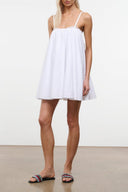 White mini dress with spaghetti straps and square neckline
