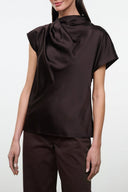 Silk top in dark brown with high mock neck and short draped sleeves