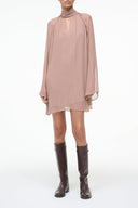 Taupe mini dress with high neck, long sleeves, and layered ruffle hem