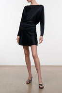 Black long-sleeve silk mini dress with ruched waist and pleated skirt