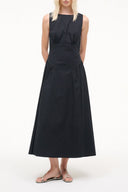 Black sleeveless midi dress with fitted waist and gathered skirt, round neckline