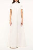 White maxi dress with short sleeves and round neck, relaxed A-line silhouette