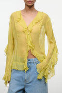 Citron yellow sheer ruffle V-neck top with tie-front, long sleeves, and layered frills