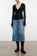 Black long-sleeve V-neck ruffled top with gathered front