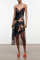Black silk slip dress with spaghetti straps, floral bird print, lace hem, midi length