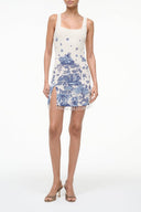 Sleeveless blue toile print dress with square neckline and tassel-trim hem