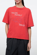 Red relaxed graphic tee with 'FEELING PRICKLY' and 'TODAY' print, crew neck